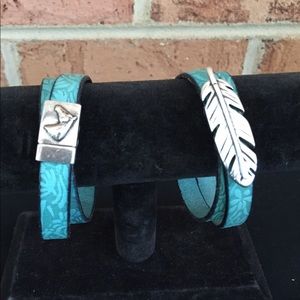 Double wrap leather bracelet w/ silver feather.